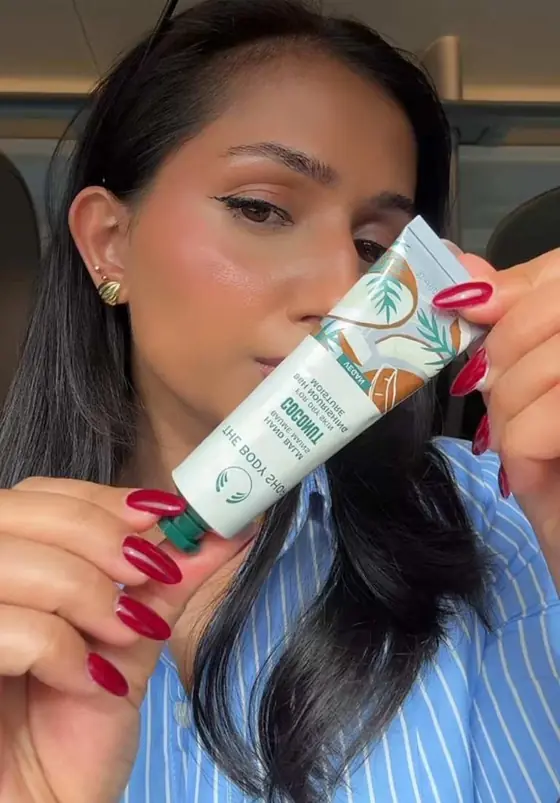 Video still, variant A: a creator demonstrating a tube of cream