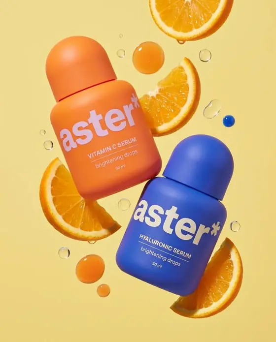 aster* ad: two serum bottles among orange slices