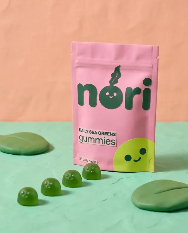 nori ad: the pouch on a peach set with green gummies