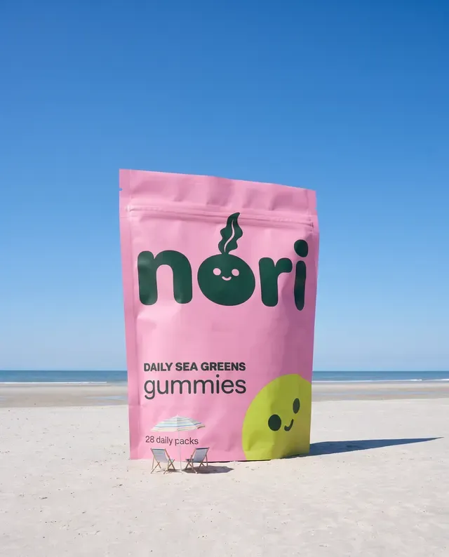 nori ad: the pouch standing on a beach